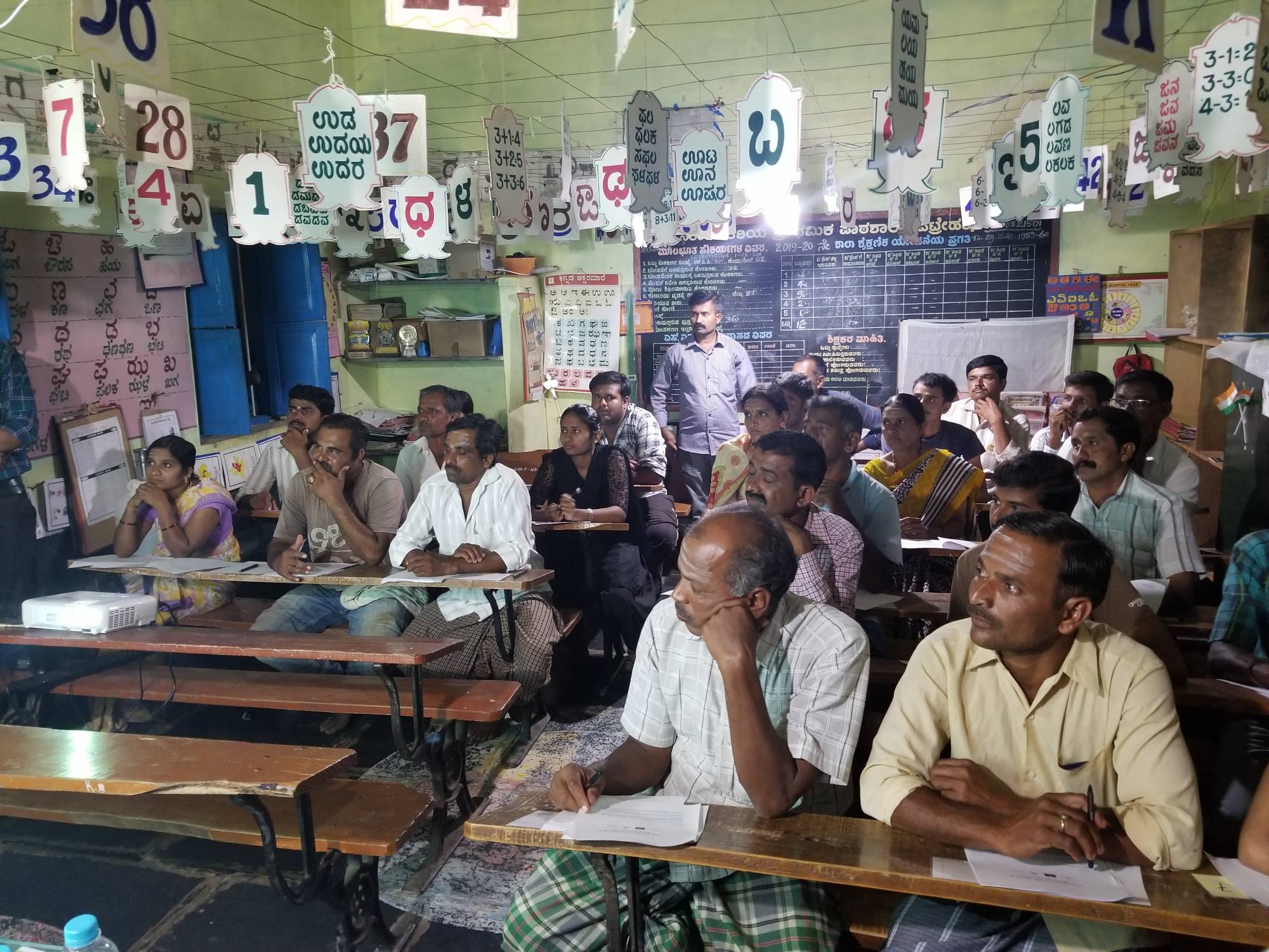 Farmers gathered in a primary school to pass the first economic experiment 